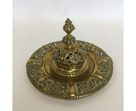 A heavy large circular inkwell with hinged top. Est. £30 - £40.
