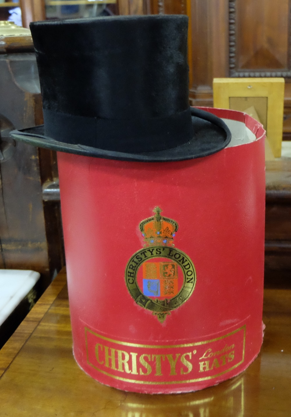 Christy’s London Cardboard Hat Box (red), with black velvet top hat by