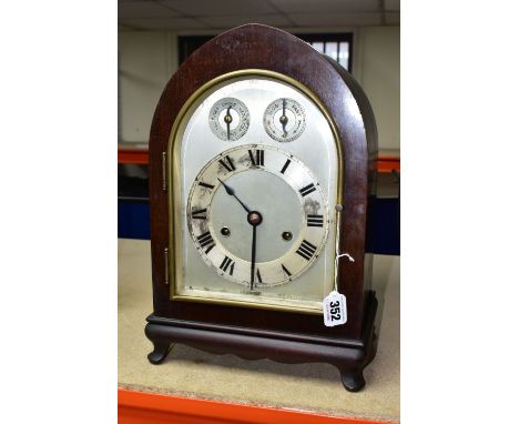 AN H.A.C MANTEL CLOCK MADE IN WURTTEMBERG GERMANY, early 20th Century with key and pendulum, in a Gothic arch style mahogany 