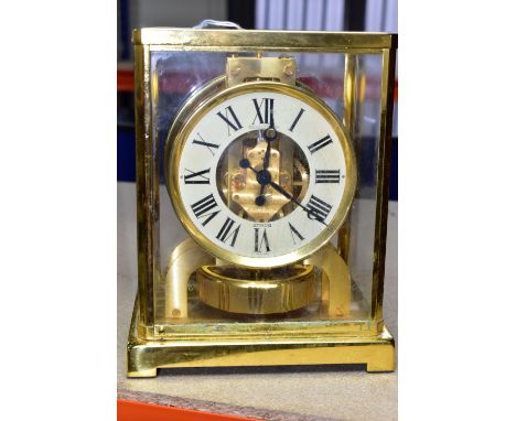 AN ATMOS JAEGER-LECOULTRE  SWISS MADE MANTEL CLOCK, in a rectangular brass and glass case, cream chapter ring with black Roma