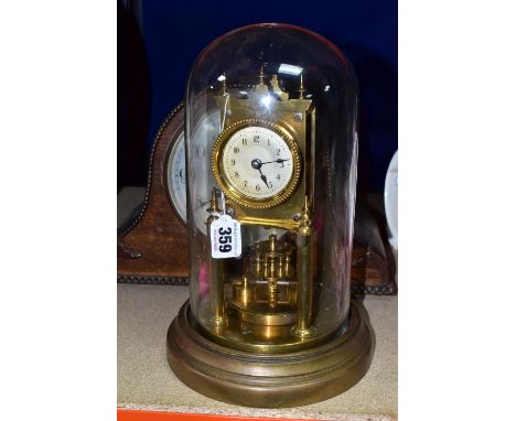 A GUSTAV BECKER TORSION CLOCK WITH GLASS DOME, stamped on the back 3760 Medaille d'or, together with an oak cased PK German m