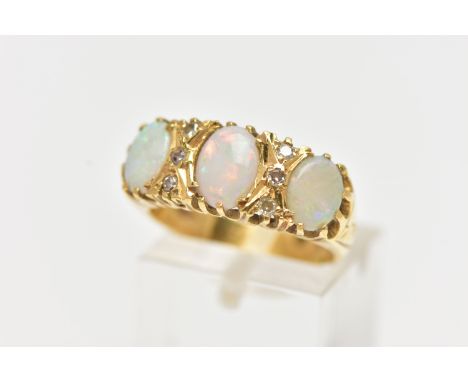 AN OPAL AND DIAMOND RING, set with three oval opal cabochons, interspaced by six single cut diamond spacers, estimated total 