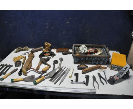 A SELECTION OF VINTAGE TOOLS to include a boxed Stanley Bailey No4 plane, spanners, files, sharpening stone, scrapers etc..