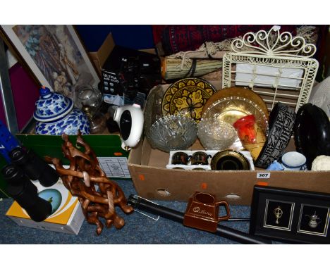 TWO BOXES OF HOUSEHOLD SUNDRIES, to include raffia baskets, small rugs, a Ricoh Mirai zoom camera, a boxed Nexfan air cooler,