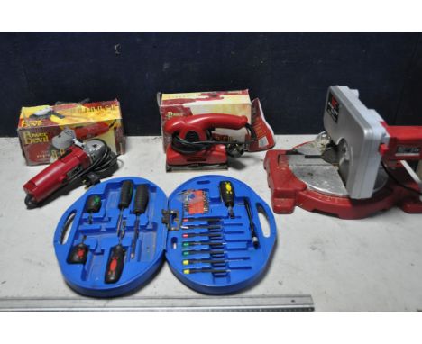 A COLLECTION OF POWER DEVIL POWERTOOLS to include a Power Devil PDW5013 Mitre saw, Power devil PDW5304 sander and a Power dev