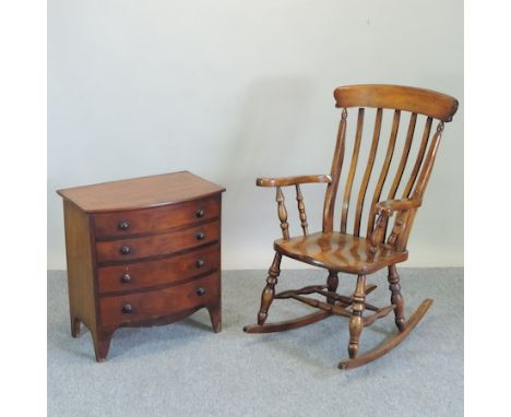 A George III mahogany bow front commode chest, 66cm, together with a 19th century style splat back rocking chair 