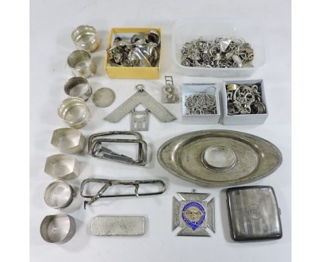 A large collection of silver items, to include napkin rings, a cigarette case, masonic badges and chains