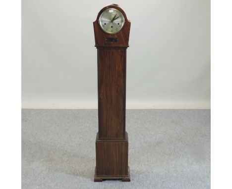An early 20th century walnut cased granddaughter clock, with Westminster chimes, 129cm tall