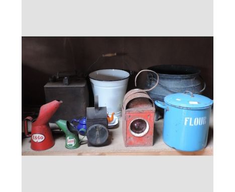 An Esso oil can, together with another, petrol cans and enamel ware 