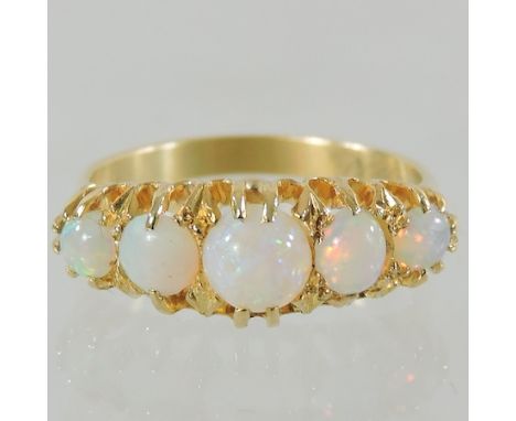 An 18 carat gold and opal five stone ring, boxed 