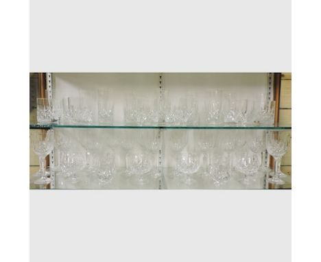 A suite of Waterford crystal 'New Grange' pattern glasses, to include whisky tumblers, brandy glasses and wine glasses 