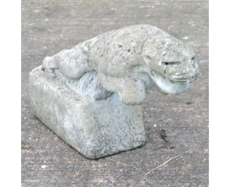 A reconstituted stone model of a jaguar, 37cm tall