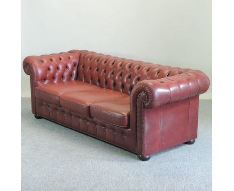A red upholstered button back Chesterfield sofa, 210cm