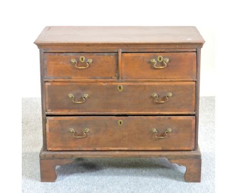 An 18th century oak chest of drawers, on bracket feet, 94cm