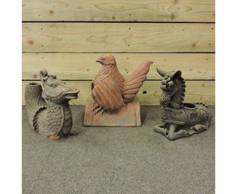 A terracotta ridge tile, in the form of a bird, 34cm tall, together with a terracotta model of a dragon and a donkey