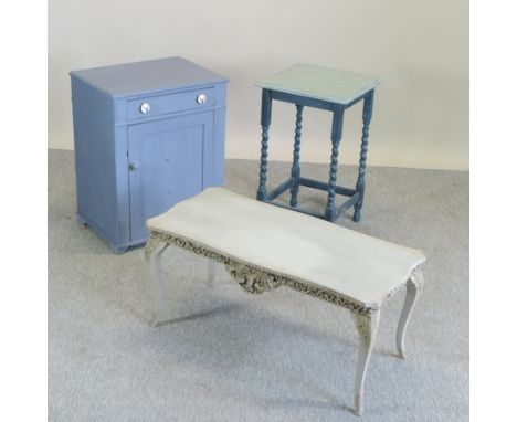 A blue painted side table cabinet, 57cm, together with a table lamp, an occasional table and a coffee table, on a carved base