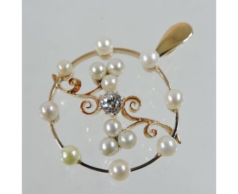 A rose gold pearl and diamond pendant, of openwork design, 3cm diameter