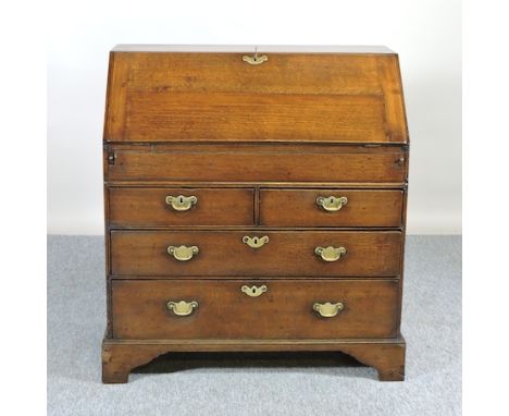 An 18th century oak bureau, on bracket feet, 91cm