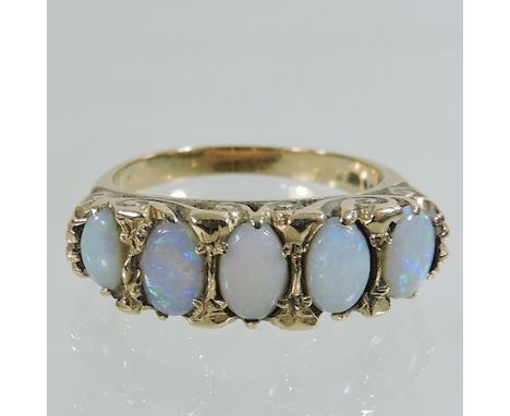 A 9 carat gold opal five stone ring 