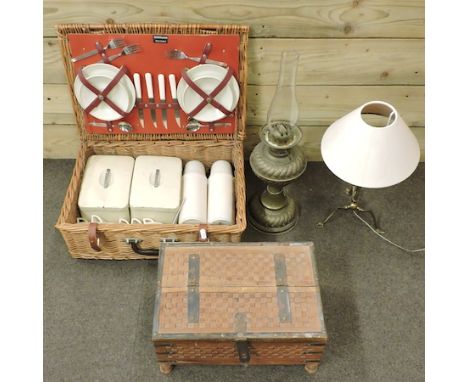 An Eastern wooden box, together with a picnic hamper, 51cm, an oil lamp, and a brass table lamp