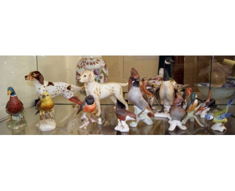 A collection of Goebel figures, fourteen in total, including birds and dogs