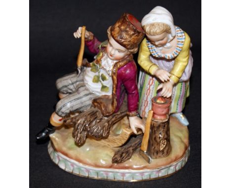 Sitzendorf 19th Century figural group, young woodcutter and somebody else. Raised on a naturalistic base CONDITION REPORT; He