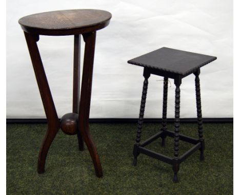 Oak circular lamp table with an unusual ball support to the legs, along with a small ebonised plant stand on bobbin supports