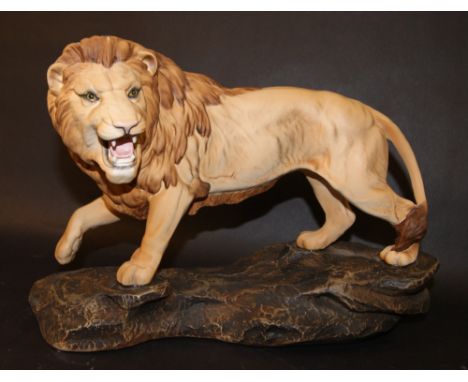 Large Beswick unglazed ceramic lion on a rock (A2554)