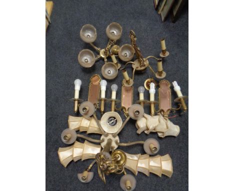 A brass six branch light fitting, two further brass five light fittings one with glass shades and three brass/copper mirrored