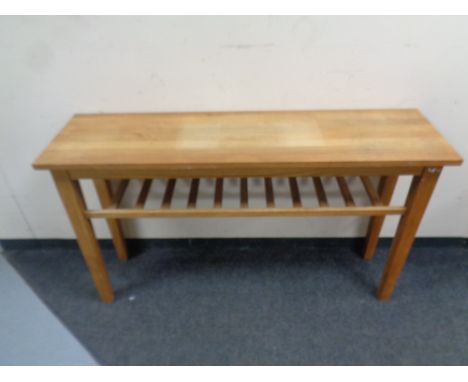 A contemporary oak hall table with under shelf, width 130 cm  