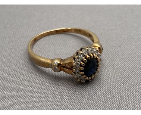 A 9ct gold diamond and sapphire ring