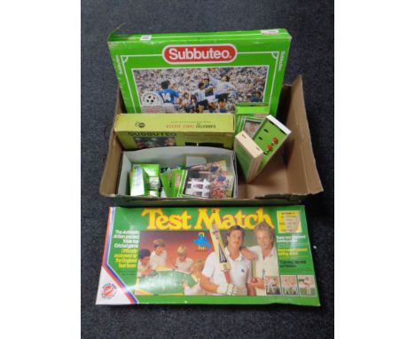 A box containing a quantity of Subbuteo sets, accessories and teams, together with a Test Match cricket game  