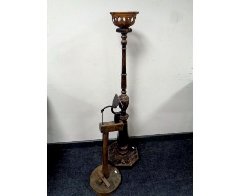 A wooden oil lamp stand together with a further wooden stand