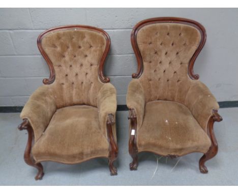 A pair of Victorian mahogany framed armchairs upholstered in a brown button dralon  