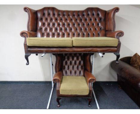 A brown button leather Chesterfield wingback settee with matching armchair  