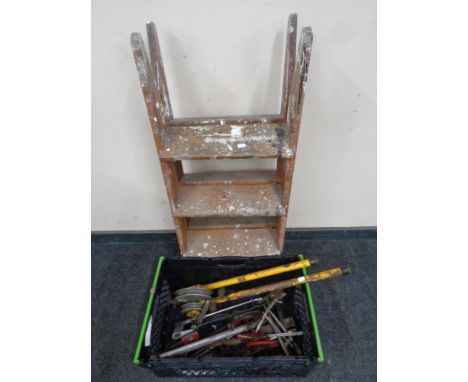 A set of wooden steps, box of hand tools, pipe bender etc 