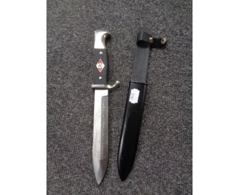 A reproduction German dagger in sheath 