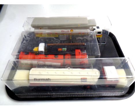 Four die cast petrol tankers, Shell, Esso, BP and Burmah in display boxes 