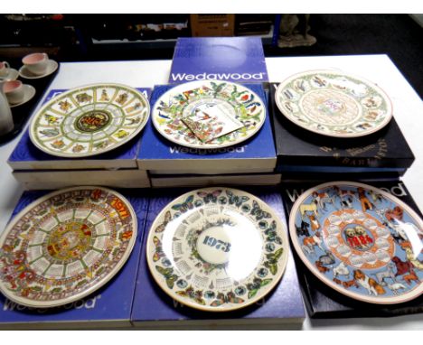 A box containing a quantity of boxed Wedgwood calendar plates 