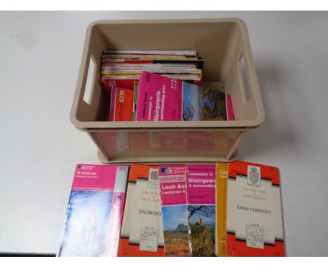 A box containing a quantity of ordnance survey maps 