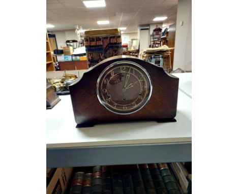 An early 20th century oak Enfield mantel clock 