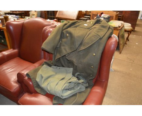 A WW2 style trench coat; and a pair of army overalls