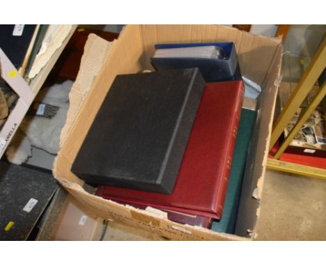 A box containing First Day covers and stamps 