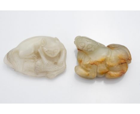 Chinese white and pale celadon with russet jade carvings of feline and bat on leaf together with a lion dog. Approx. 6.5cm le