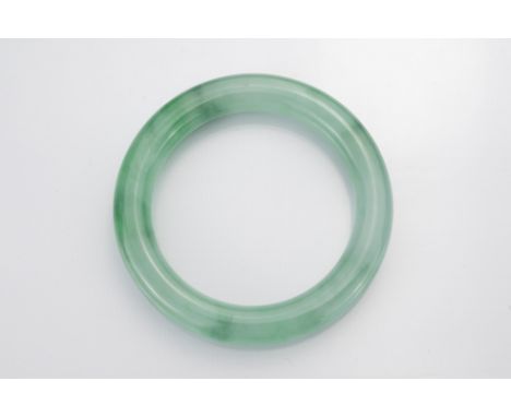 Chinese jadite / jade bangle of cylindrical form. Diam. 8cm. Inner diam. 5.8cm 