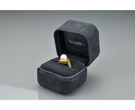 A Chinese gold and pearl ring, stamped with 850 and a Chinese character. Ring size R. Total weight 4.3 grams. 