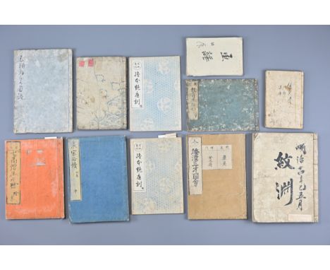 Eleven Japanese 19th Century Woodblock Printed Books, Various. A mixture of eleven books of various sizes containing illustra