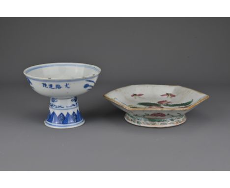 A Chinese 19th Century blue and white porcelain stem bowl decorated with a lotus pond scene, the exterior with four-character