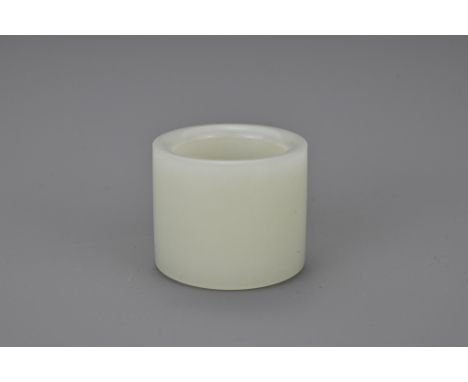A Chinese white jade archer's ring. Of plain cylindrical form. Length 28mm. Width 33mm Provenance: Property of an English gen
