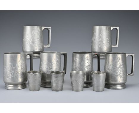 Six Chinese pewter dragon tankards with glass bases by Huikee Swatow. Together with four matching pewter measuring cups, all 